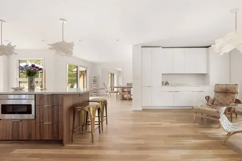 a kitchen with a sink cabinets and window