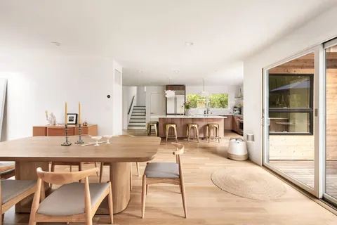 a view of a dining room with furniture and window