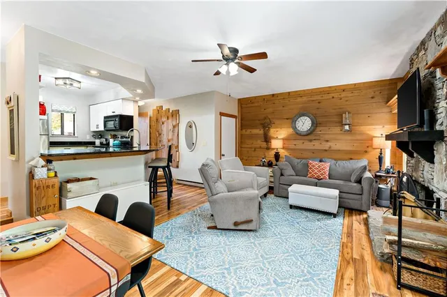 a living room with fireplace furniture and a flat screen tv