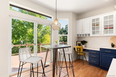 a view of a house with a big yard and large trees