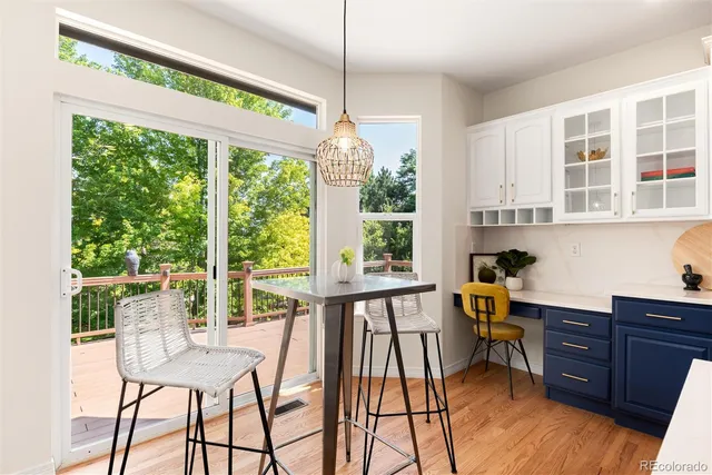 a view of a house with a big yard and large trees