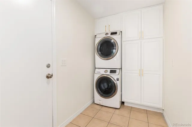 a bathroom with a sink a large mirror and a bathtub next to a window