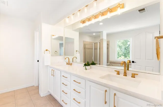 a living room with furniture a window and a flat screen tv