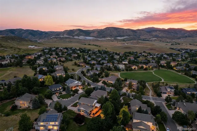 a view of a room with wooden floor and window
