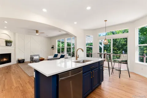 a bedroom with a bed a plant and a window