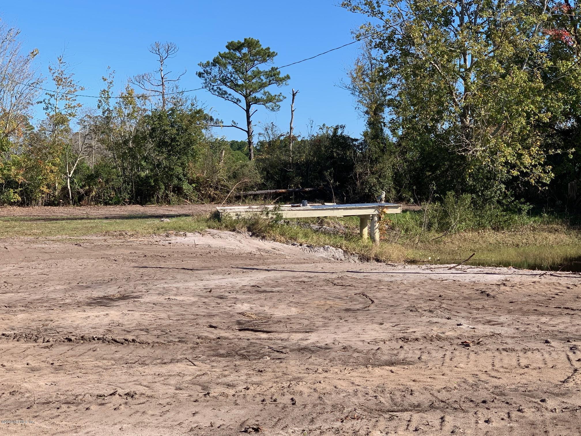 10451 Sawpit Road Jacksonville, FL 32226 - Photo 25 of 37 a view of a yard with large trees