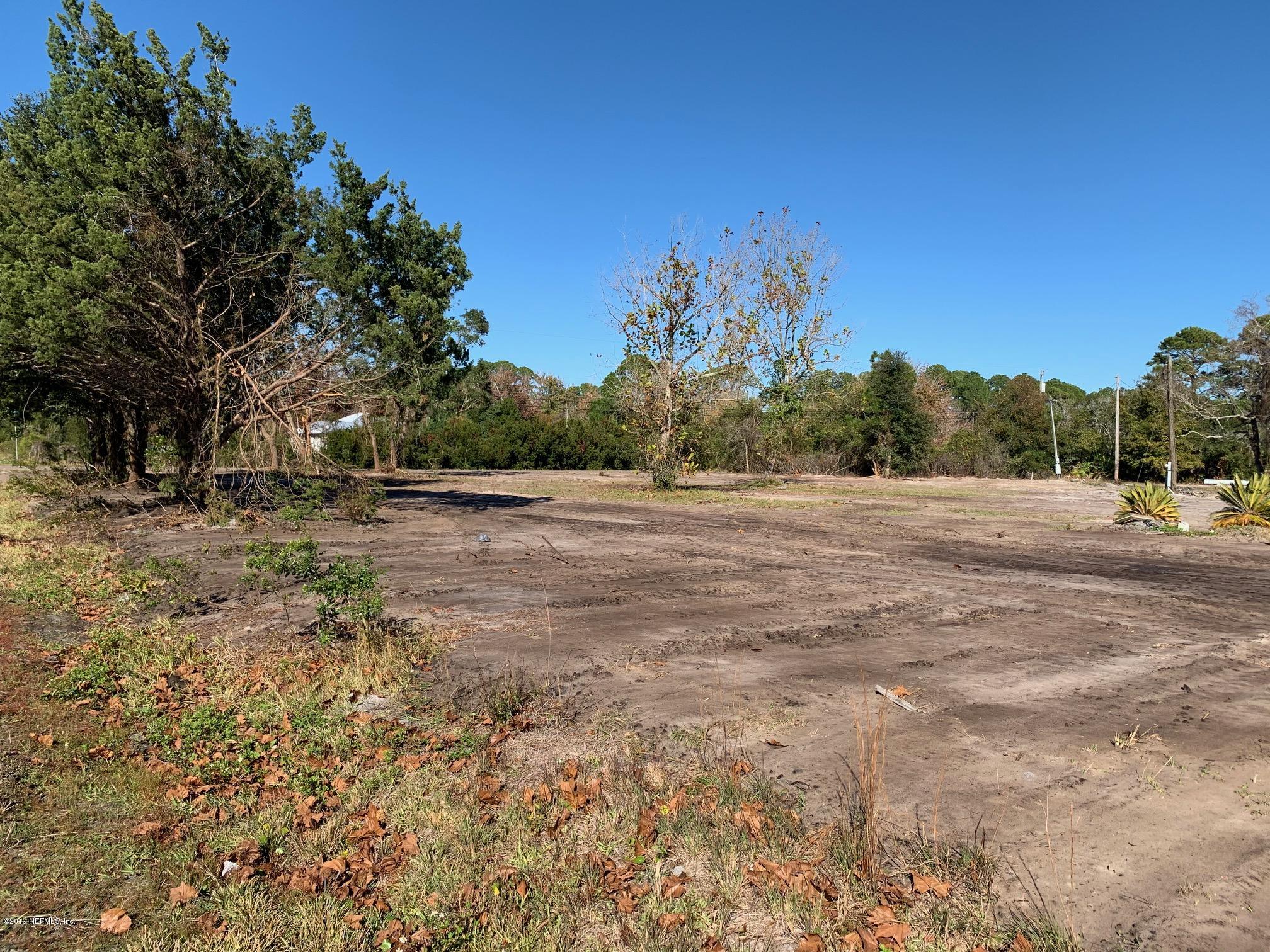 10451 Sawpit Road Jacksonville, FL 32226 - Photo 3 of 37 a view of a field with trees in background