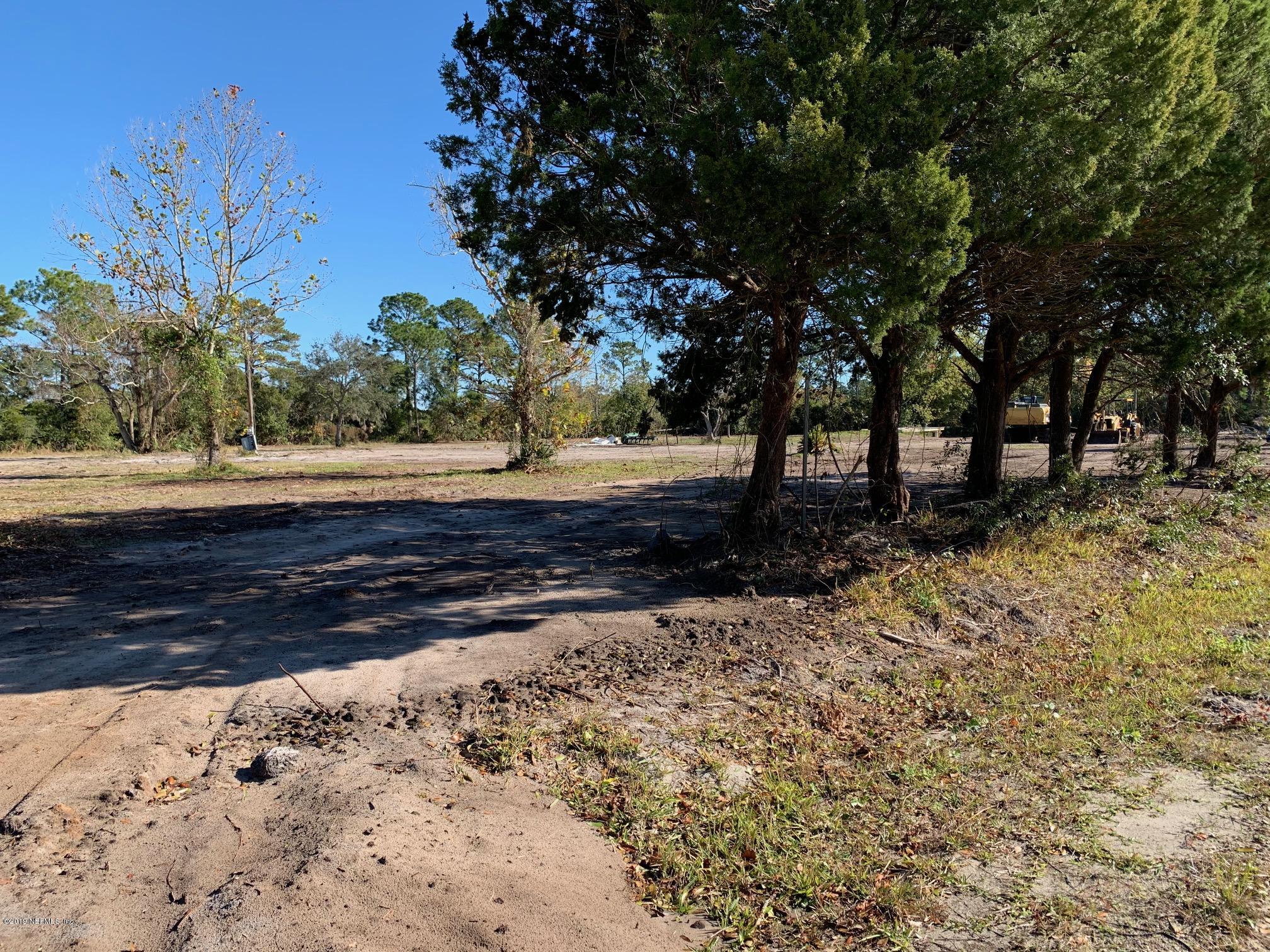 10451 Sawpit Road Jacksonville, FL 32226 - Photo 10 of 37 a view of dirt yard with a large tree