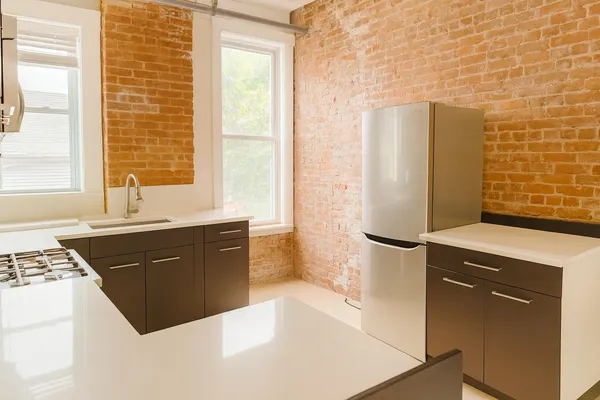 a kitchen with a refrigerator and a sink
