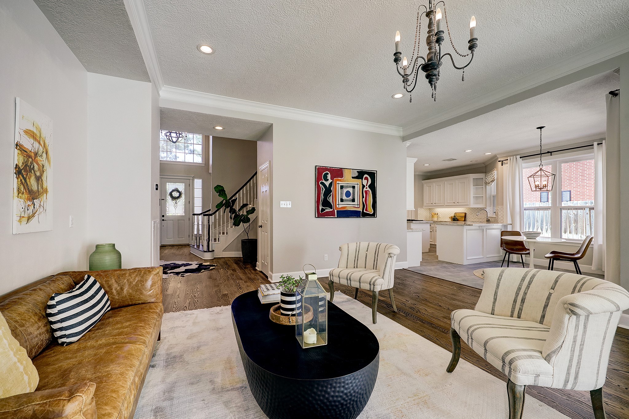 18902 Mountain Spring Drive Spring, TX 77379 - Photo 11 of 32 a living room with furniture and a chandelier