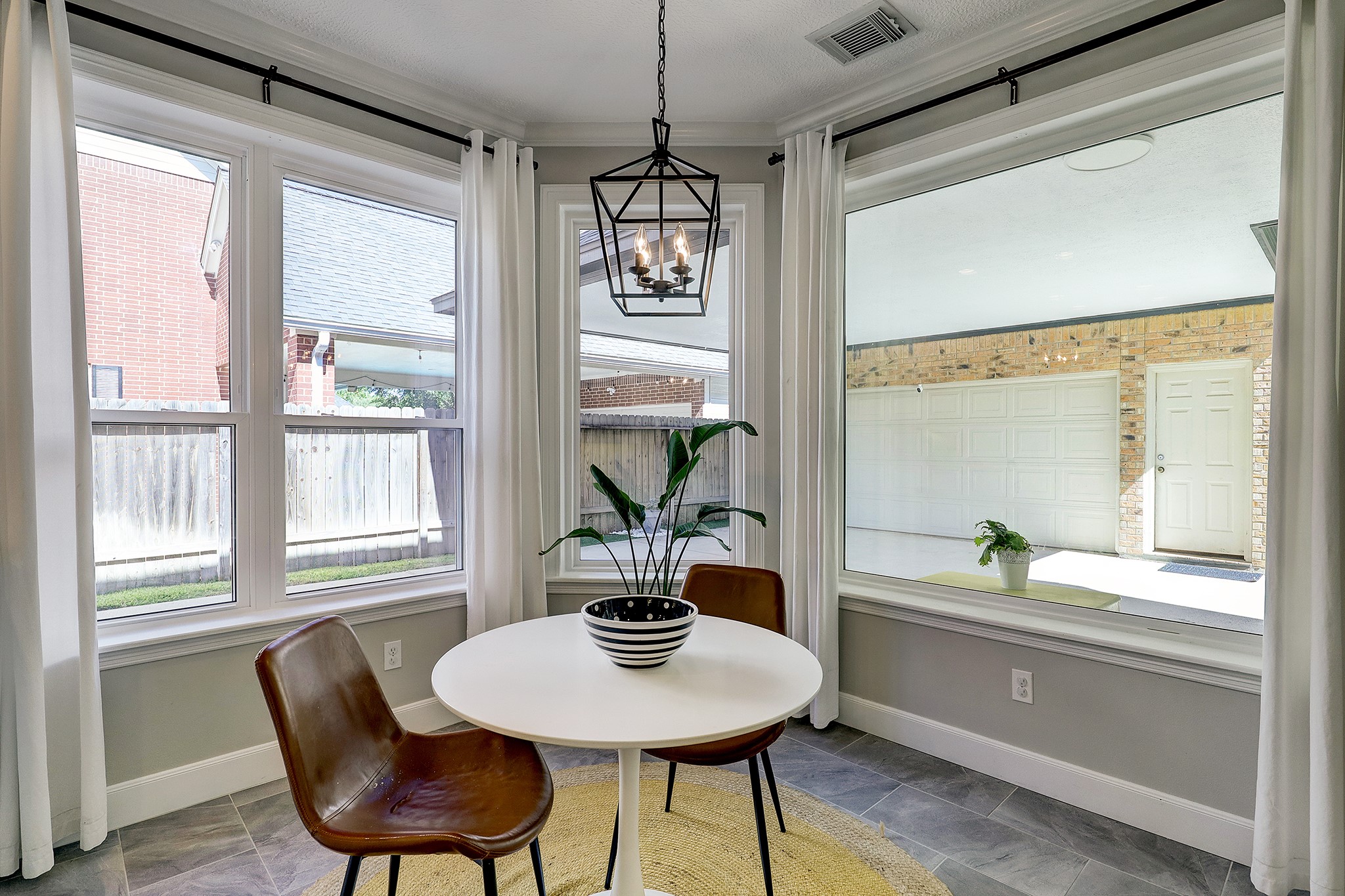 18902 Mountain Spring Drive Spring, TX 77379 - Photo 12 of 32 a dining room with furniture a chandelier and wooden floor