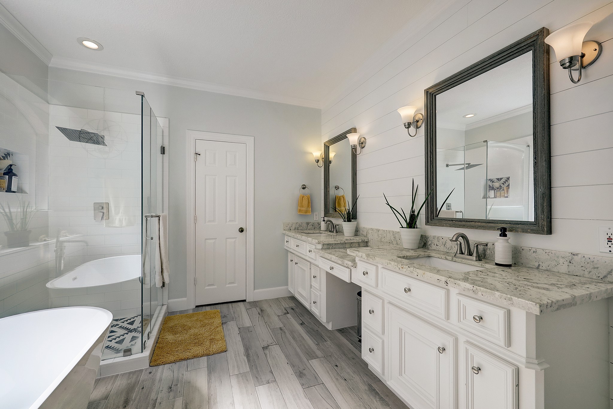 18902 Mountain Spring Drive Spring, TX 77379 - Photo 21 of 32 a spacious bathroom with a granite countertop sink mirror and a bathtub