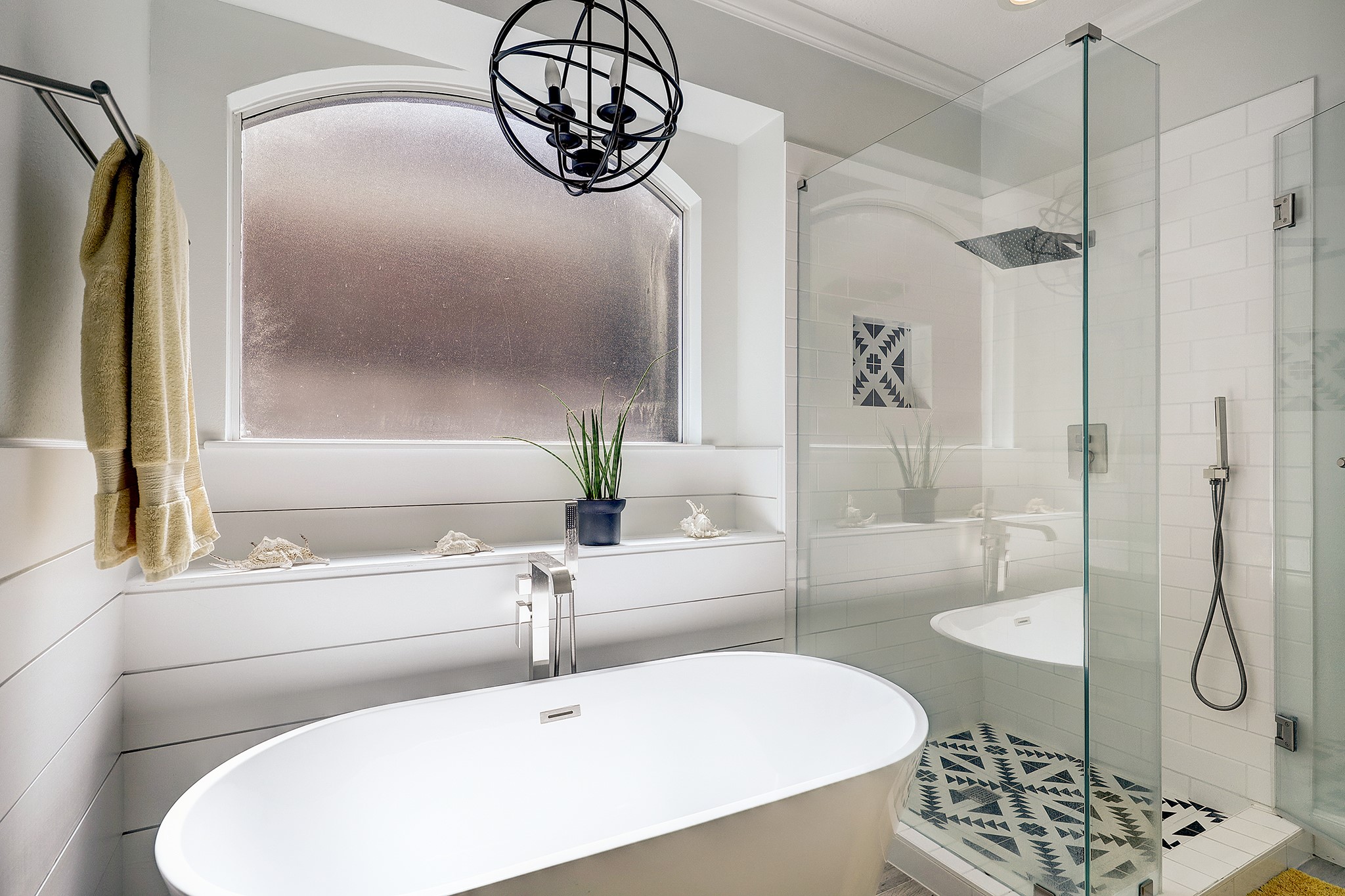 18902 Mountain Spring Drive Spring, TX 77379 - Photo 22 of 32 a bathroom with a tub a sink and mirror