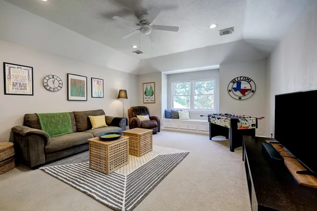 a view of a livingroom with workspace and a couch
