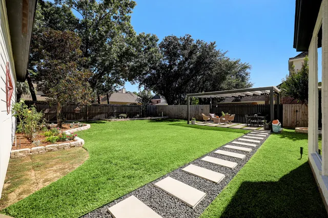 a building outdoor space with patio furniture and potted plants