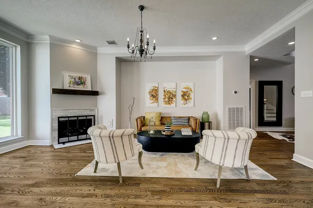 a living room with furniture or fireplace and a table