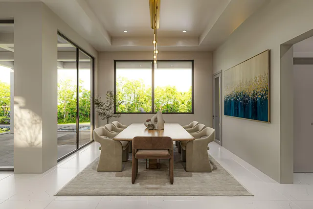 a dining room with furniture and window