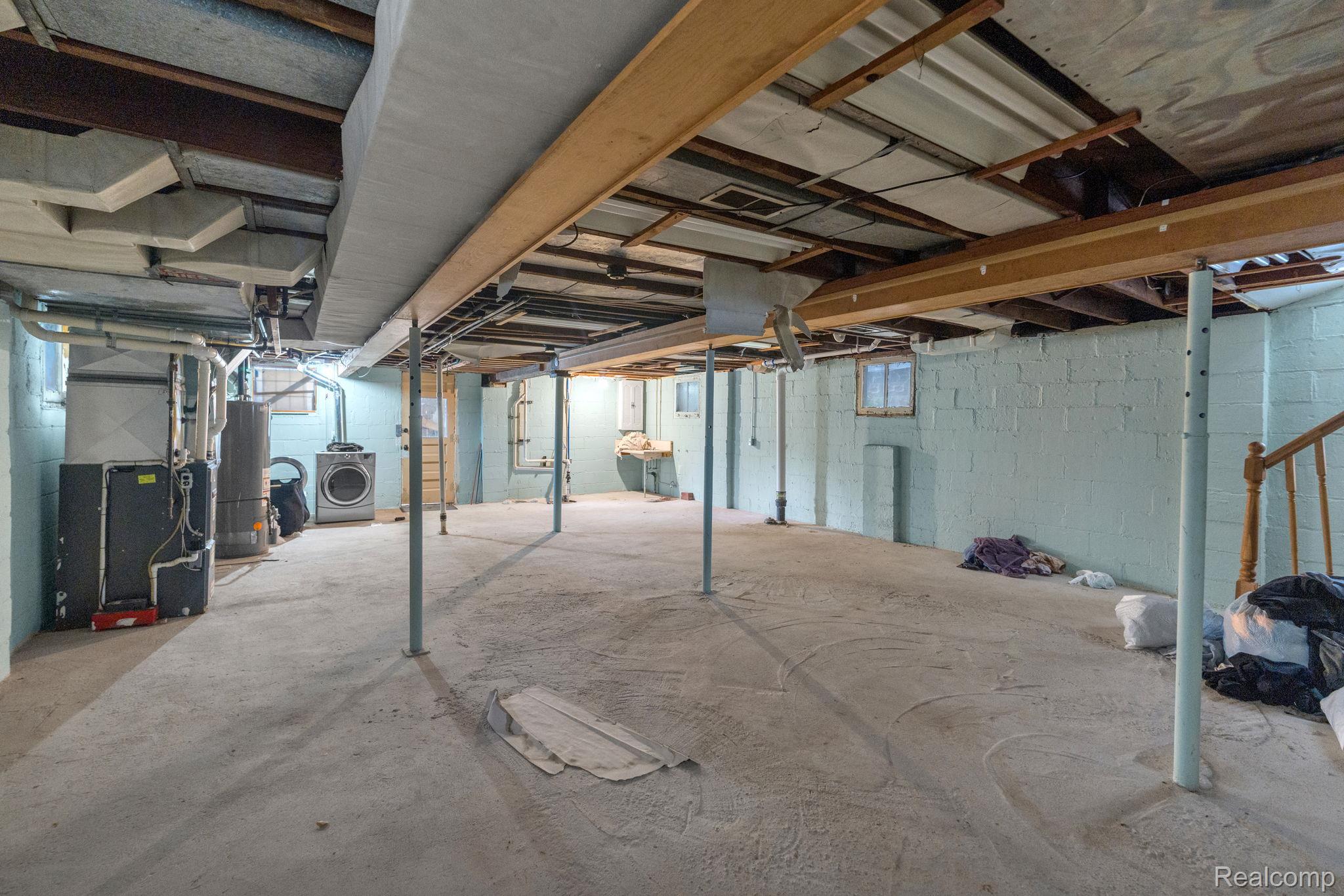 7631 Maple Street Dearborn, MI 48126 - Photo 47 of 48 Concrete flooring basement with exposed structural beams and support columns
