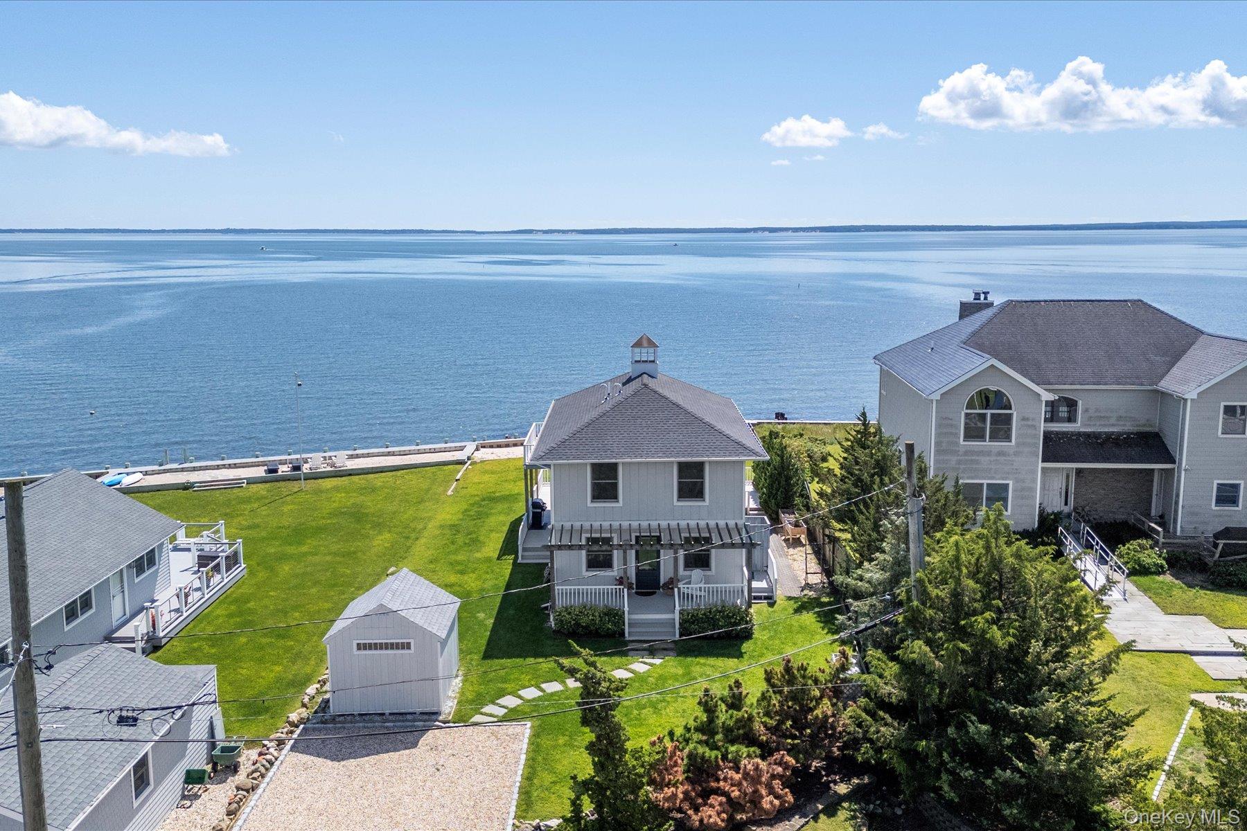 4415 Camp Mineola Road Mattituck, NY 11952 - Photo 33 of 44 Unobstructed Peconic Bay vistas stretching to Southampton and the Shinnecock Canal.