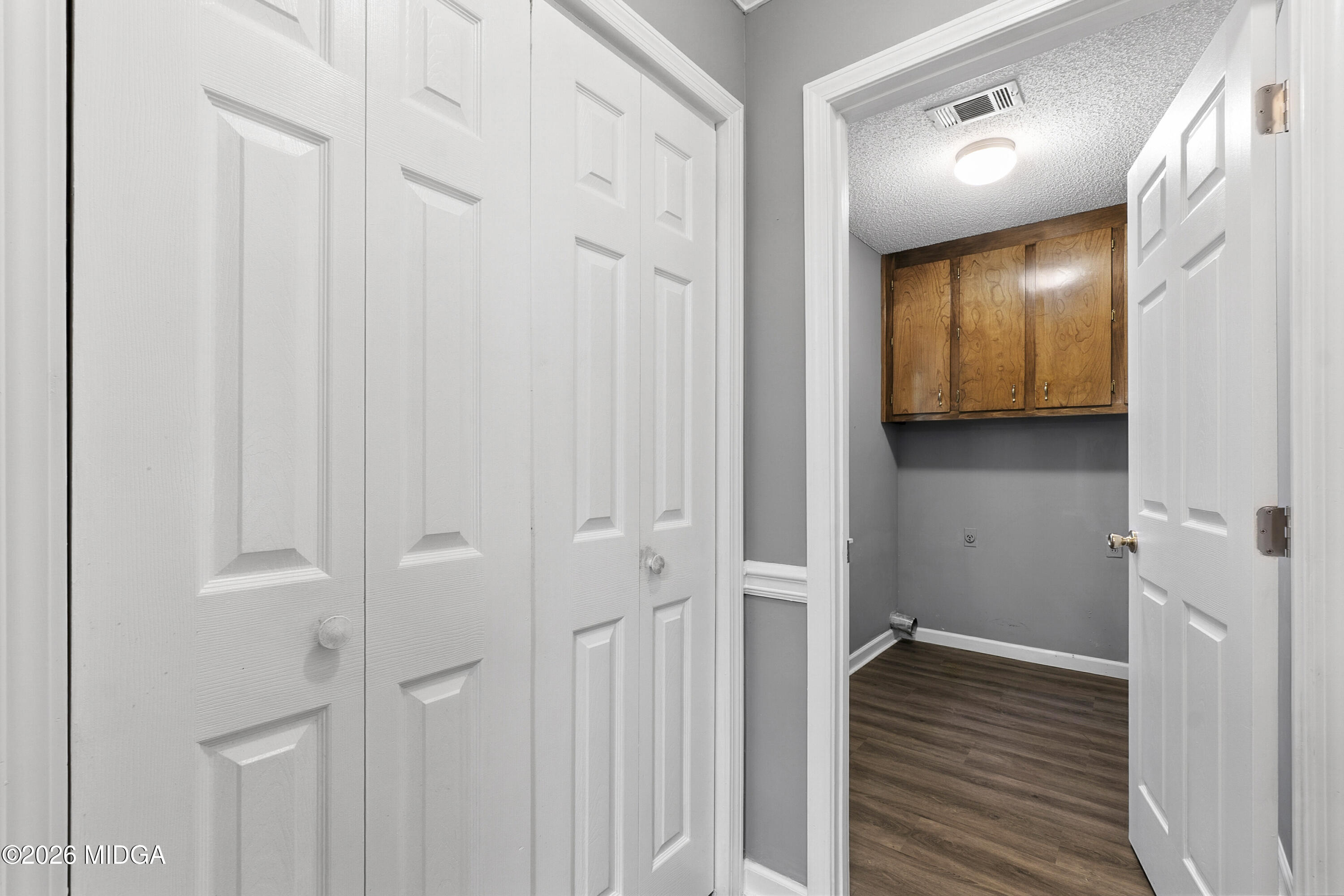 5626 Janeru Circle Macon, GA 31216 - Photo 16 of 45 a view of a hallway with wooden floor and closet area