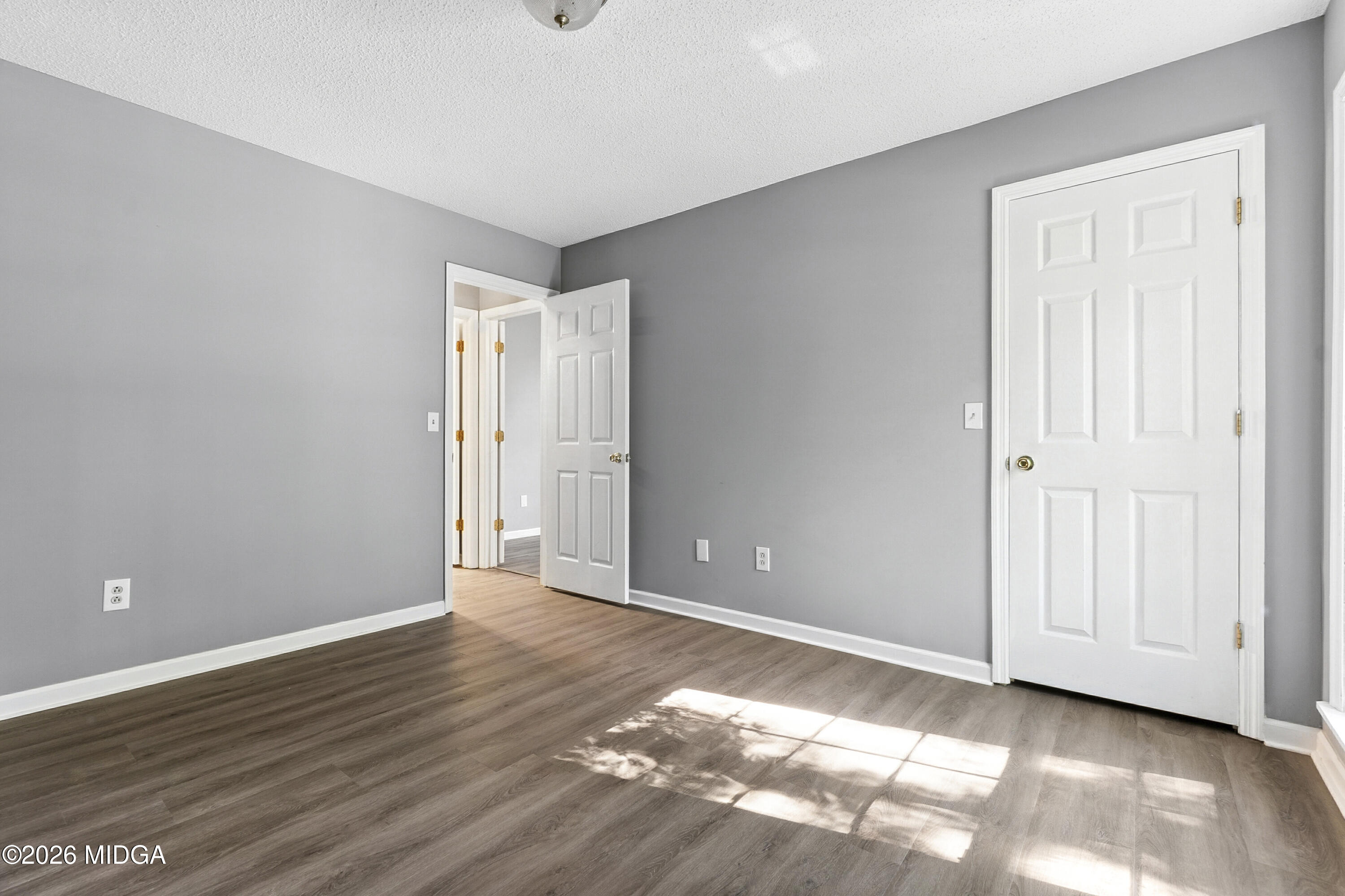 5626 Janeru Circle Macon, GA 31216 - Photo 21 of 45 a view of an empty room with wooden floor