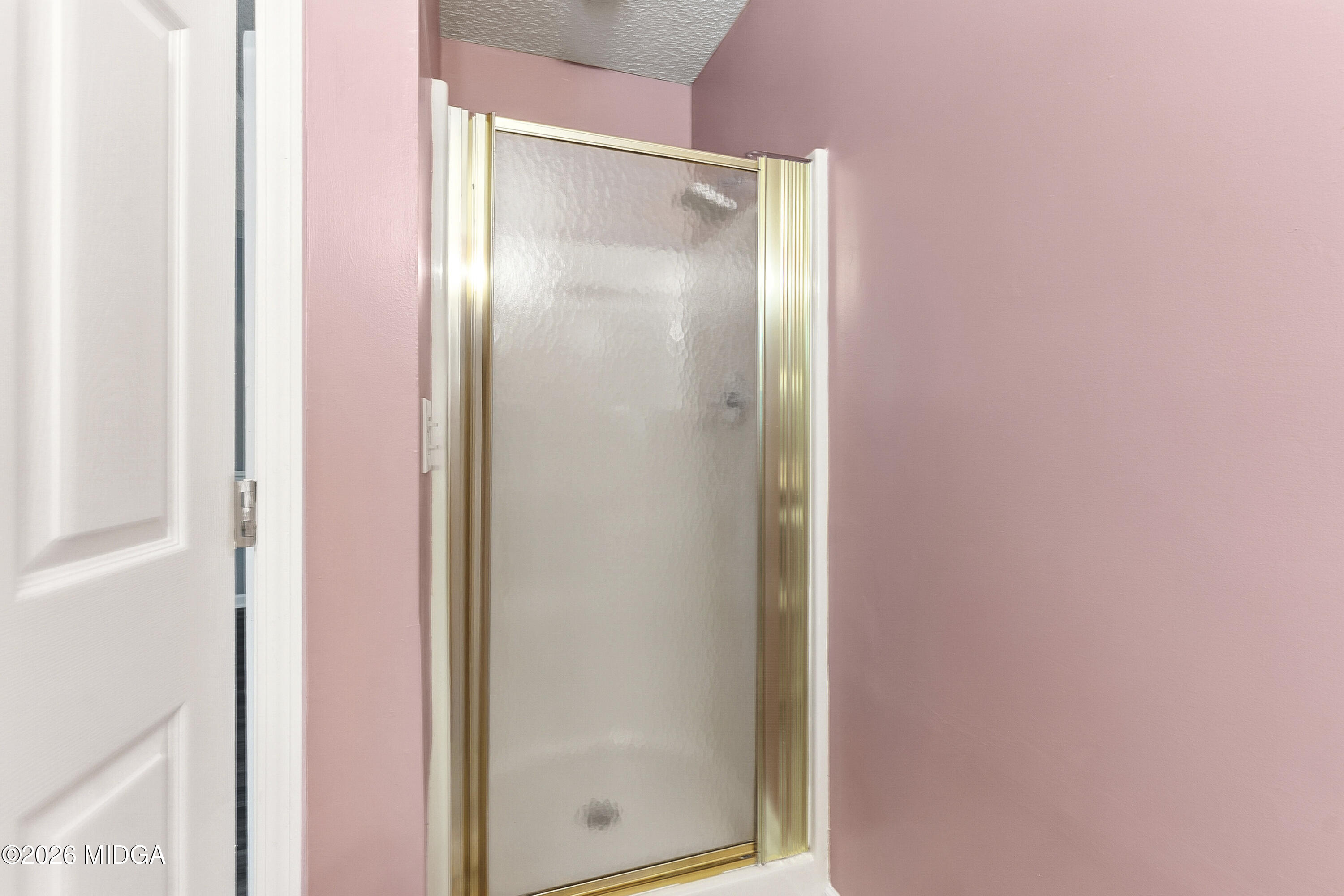 5626 Janeru Circle Macon, GA 31216 - Photo 24 of 45 a bathroom with a glass shower door and mirror
