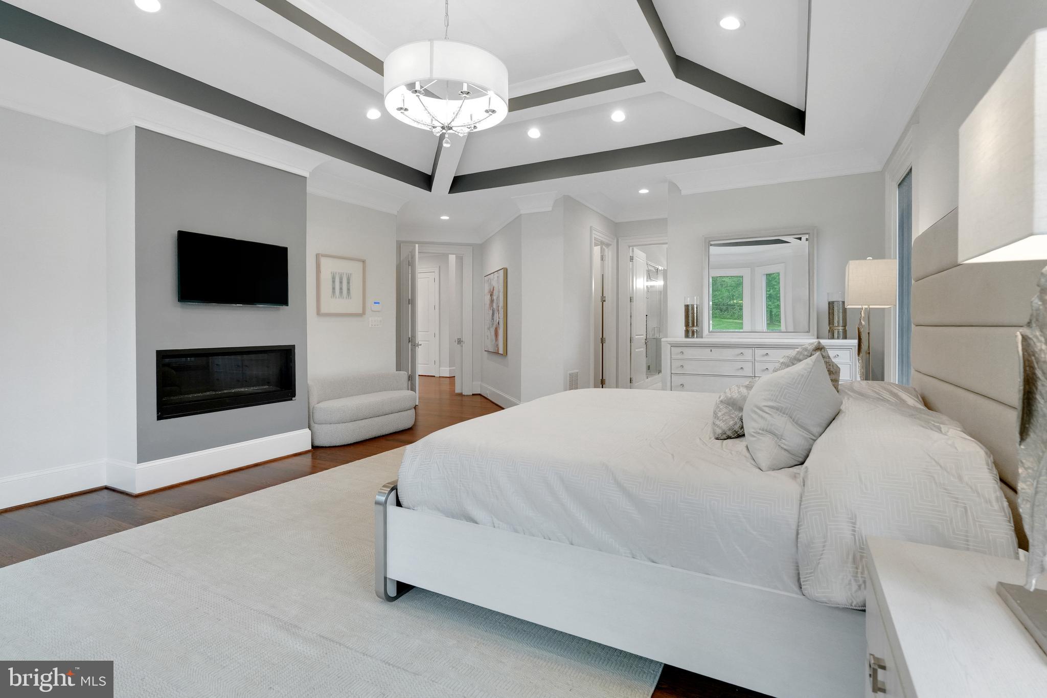 305 Old Courthouse Road Northeast Vienna, VA 22180 - Photo 26 of 69 a spacious bedroom with a bed and a flat screen tv