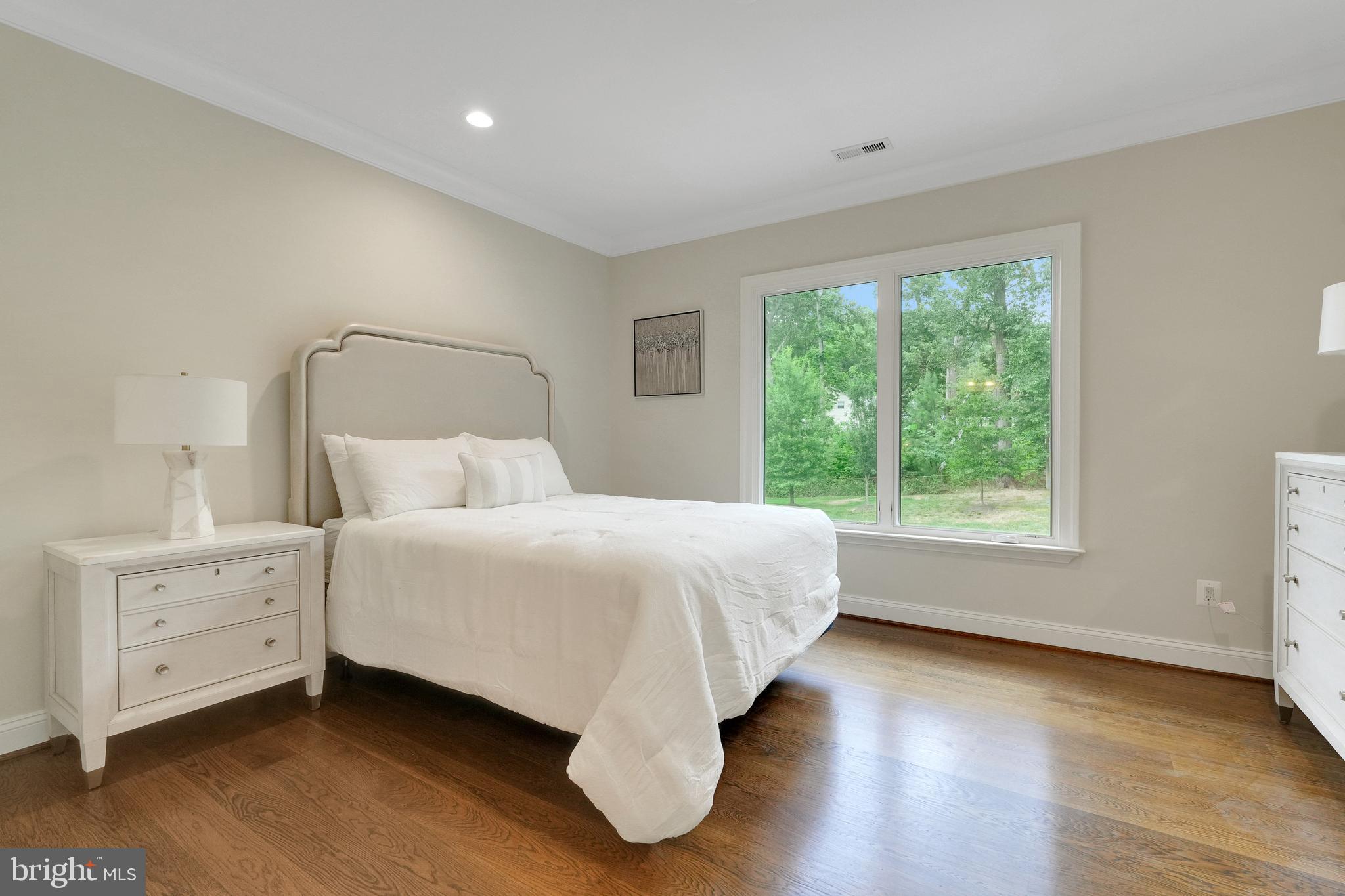 305 Old Courthouse Road Northeast Vienna, VA 22180 - Photo 41 of 69 a bedroom with a large bed and a window