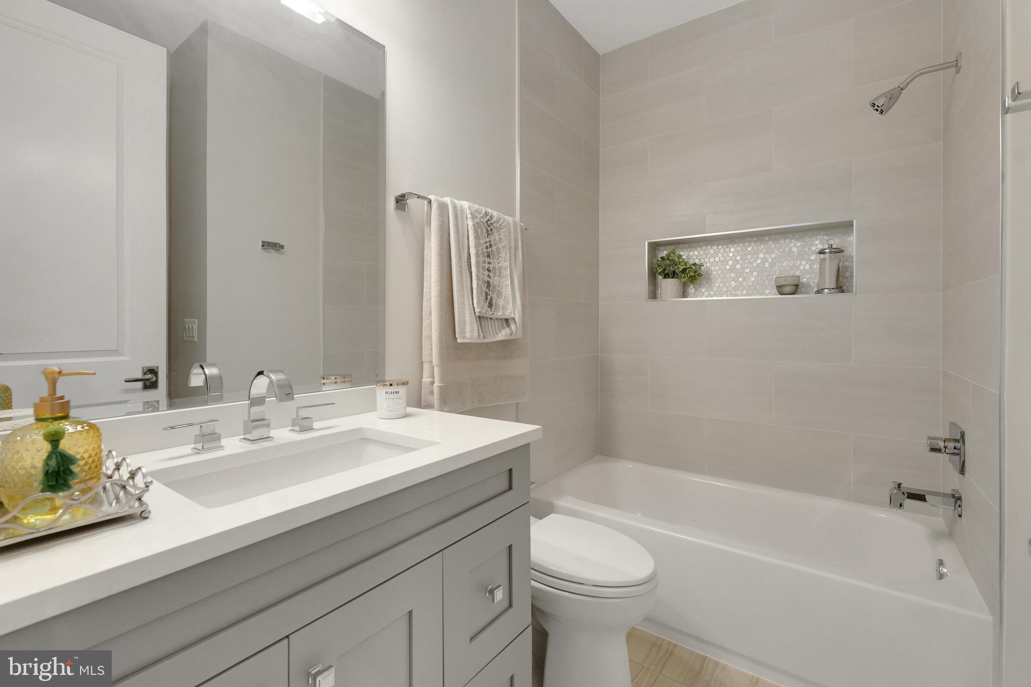 305 Old Courthouse Road Northeast Vienna, VA 22180 - Photo 42 of 69 a bathroom with a sink a toilet and bathtub