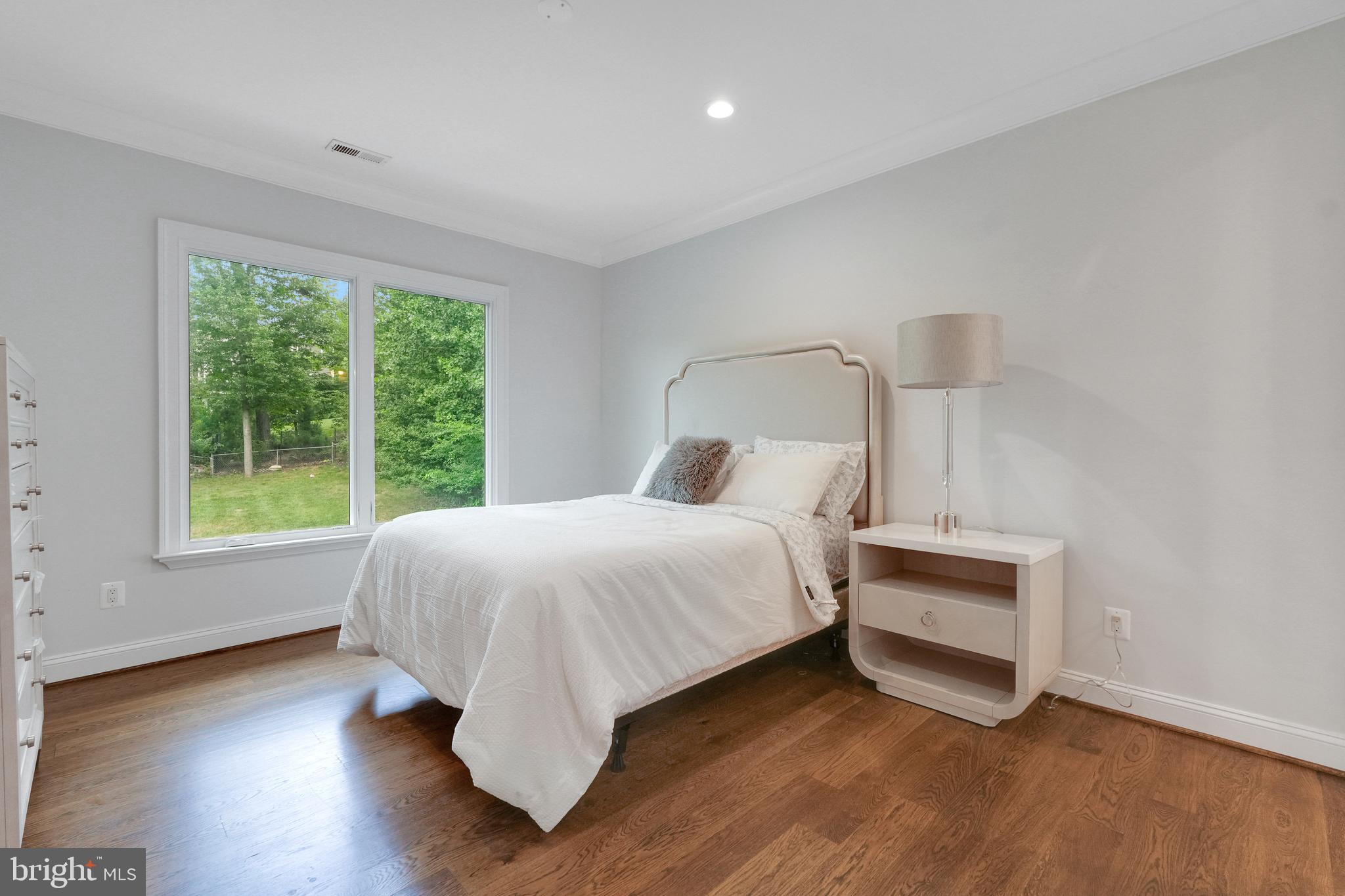 305 Old Courthouse Road Northeast Vienna, VA 22180 - Photo 45 of 69 a bed room with a bed and a chair