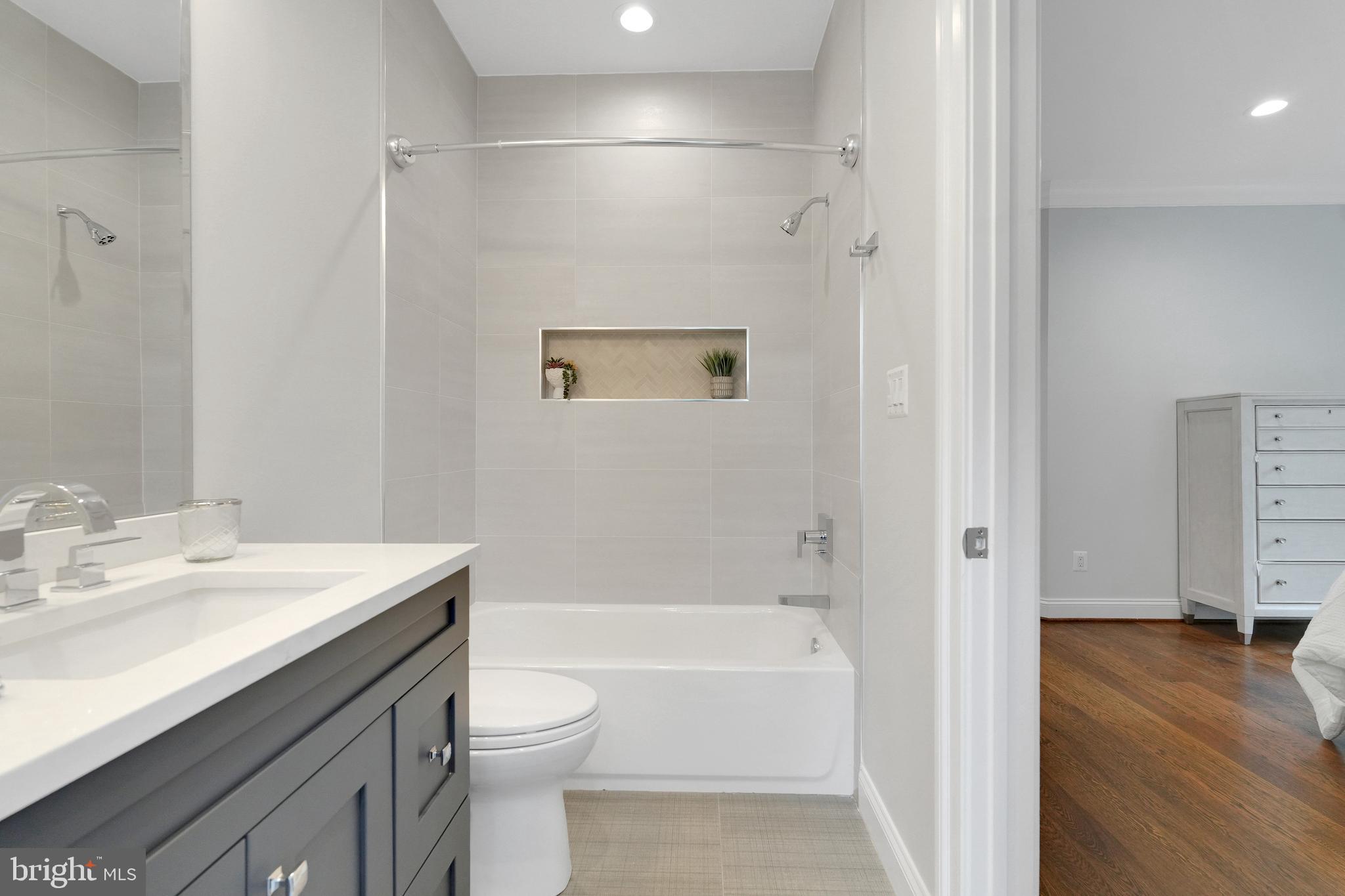 305 Old Courthouse Road Northeast Vienna, VA 22180 - Photo 46 of 69 a bathroom with a sink a toilet and a bathtub
