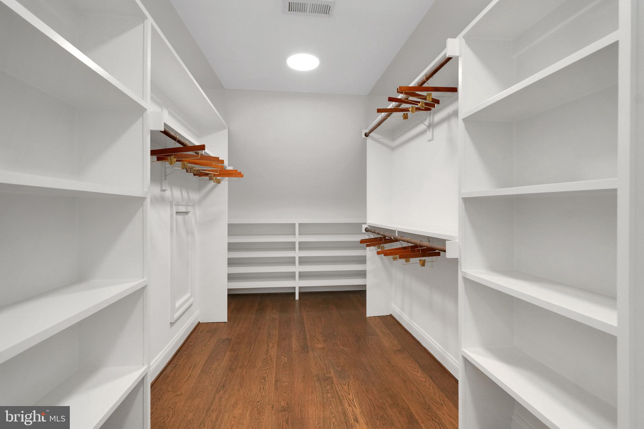 305 Old Courthouse Road Northeast Vienna, VA 22180 - Photo 47 of 69 a view of walk in closet with empty racks