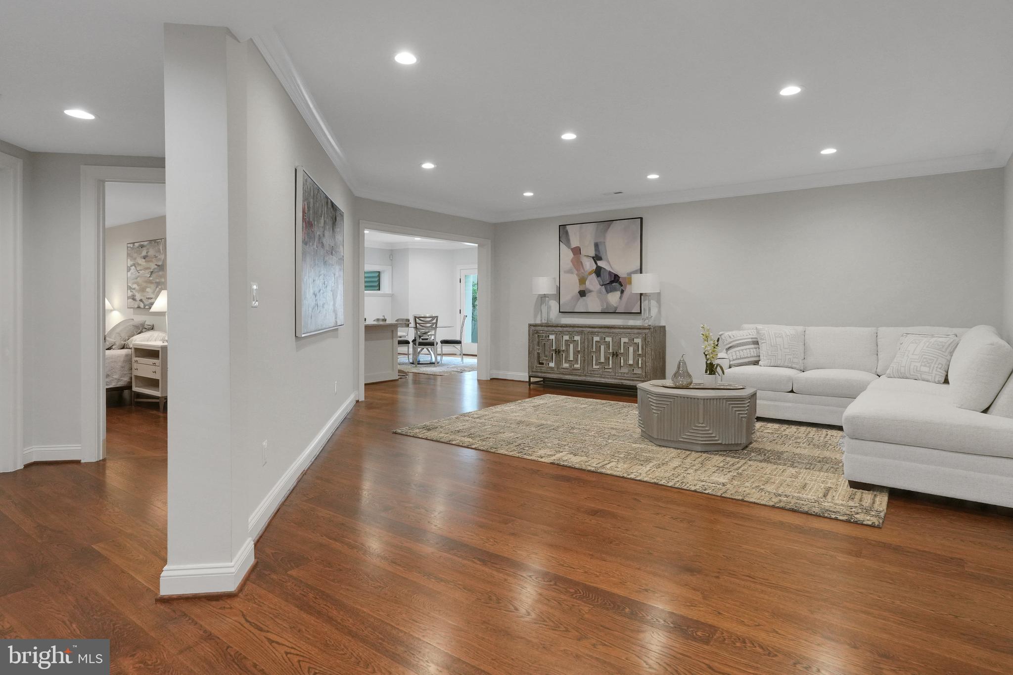 305 Old Courthouse Road Northeast Vienna, VA 22180 - Photo 48 of 69 a living room with furniture and a wooden floor
