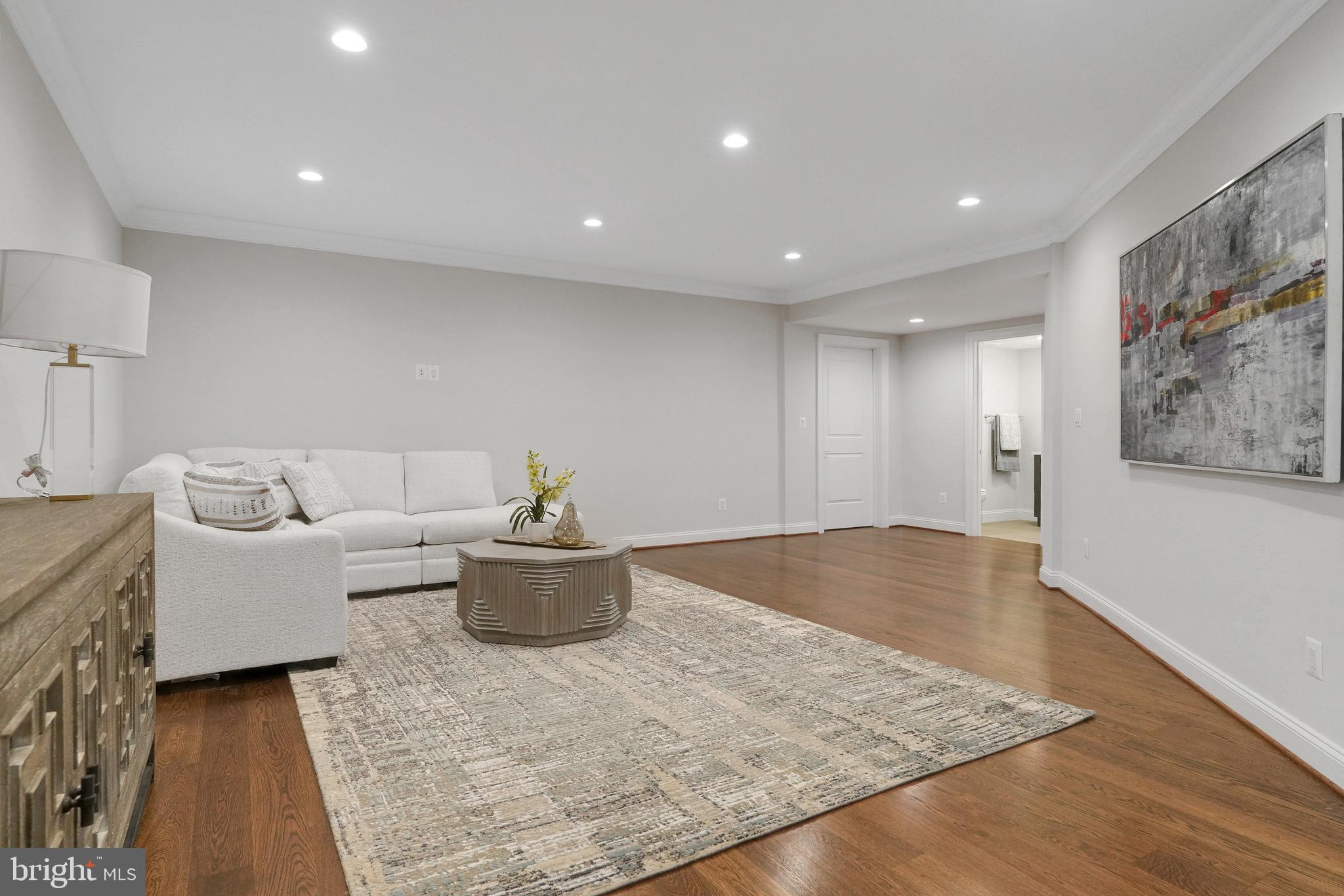 305 Old Courthouse Road Northeast Vienna, VA 22180 - Photo 49 of 69 a living room with furniture and a table