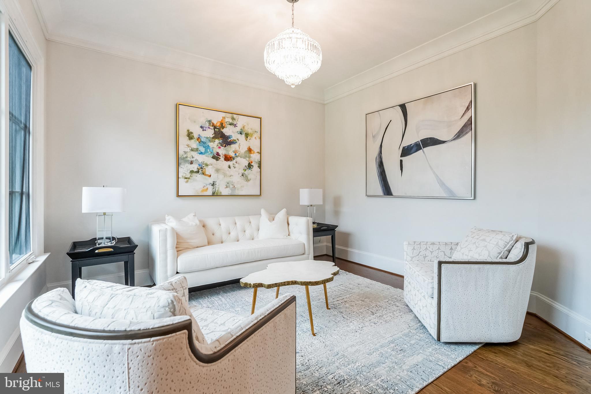 305 Old Courthouse Road Northeast Vienna, VA 22180 - Photo 7 of 69 a living room with furniture a rug and a wall painting