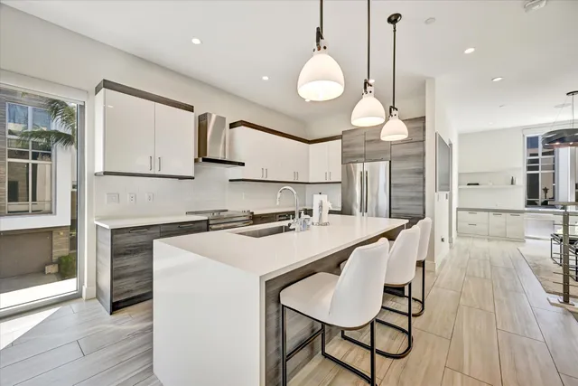 a kitchen with a table and chairs in it