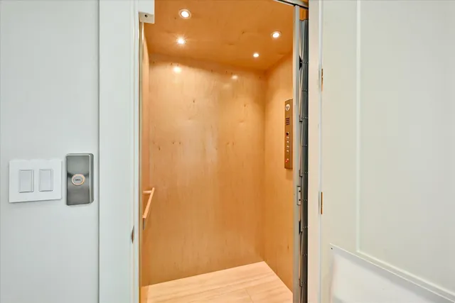 a view of a bathroom from a hallway