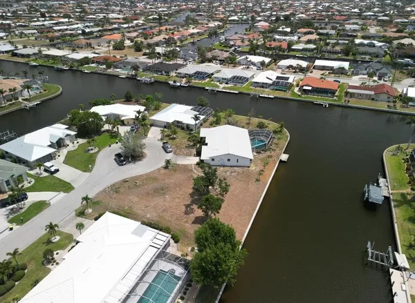 an aerial view of a house with a lake view