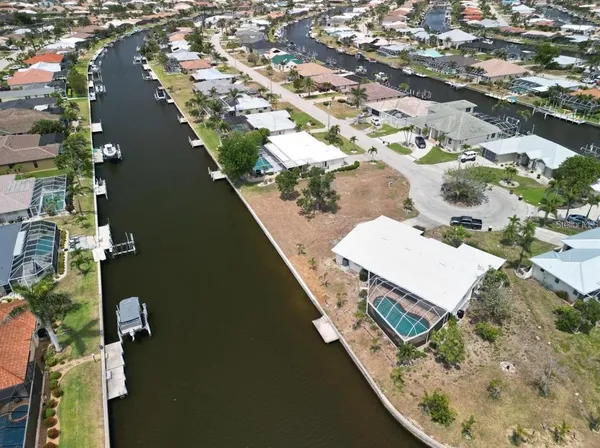 an aerial view of a house with a lake view