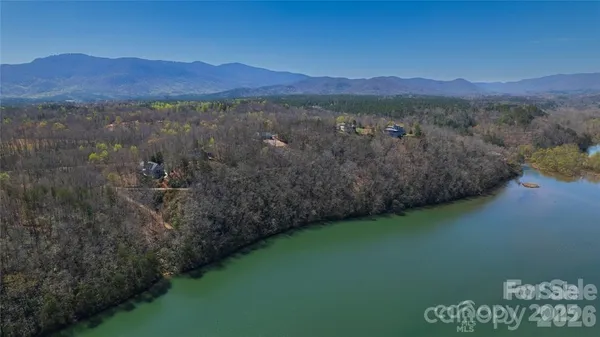 a view of a lake in between two of trees