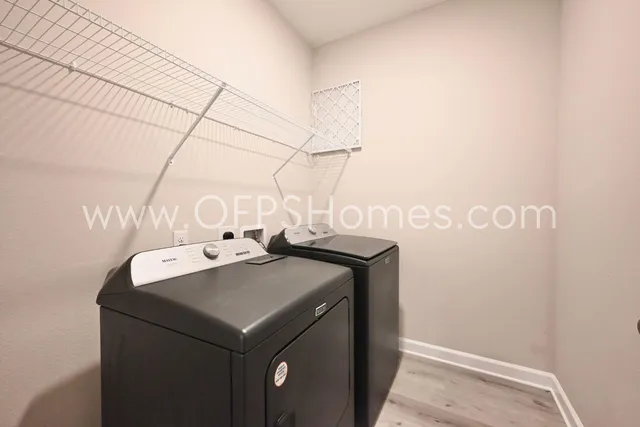 a utility room with dryer and washer