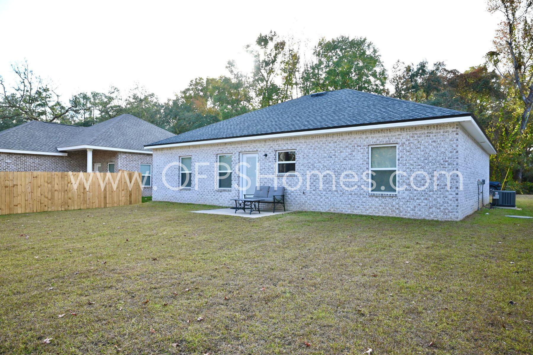 113 Shady Lane Crestview, FL 32536 - Photo 20 of 25 a view of a house with garden and deck