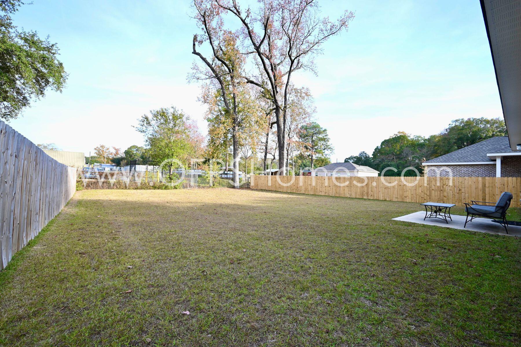 113 Shady Lane Crestview, FL 32536 - Photo 24 of 25 a view of backyard with outdoor space and trees