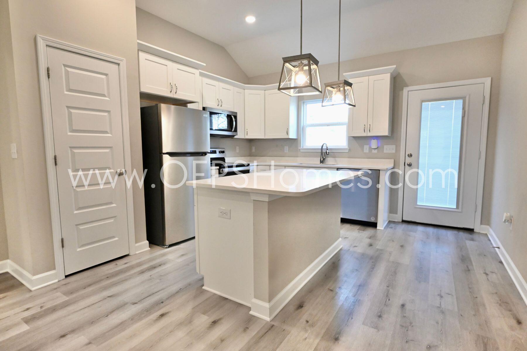 113 Shady Lane Crestview, FL 32536 - Photo 5 of 25 a kitchen with cabinets and stainless steel appliances