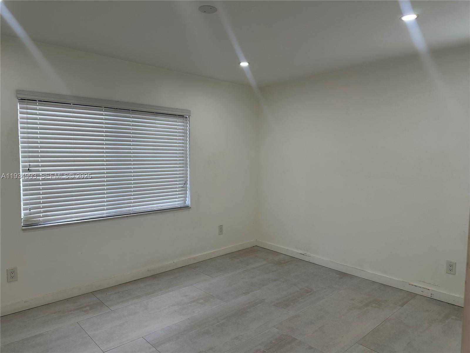 2832 Southwest 124th Court Miami, FL 33175 - Photo 13 of 30 an empty room with a window