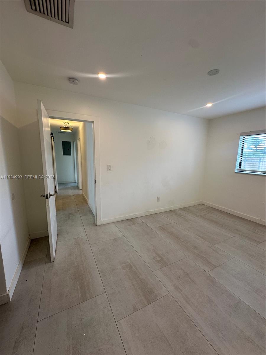 2832 Southwest 124th Court Miami, FL 33175 - Photo 24 of 30 an empty room with a natural light