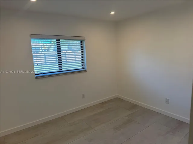 a kitchen with stainless steel appliances granite countertop a refrigerator oven a sink and dishwasher