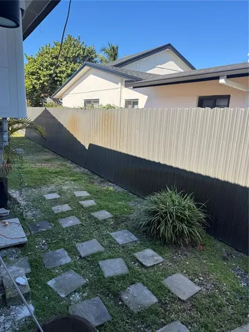 a house view with a backyard space
