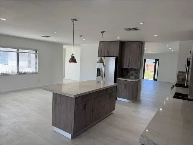 a view of a kitchen with a sink