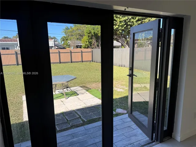 a house view with a backyard space